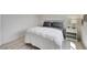 Bright bedroom featuring a cozy bed with plush pillows and a classic nightstand at 6830 Compass St, North Las Vegas, NV 89084
