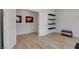 Clean bonus room with a view of the hallway, floating shelves, and art pieces at 6830 Compass St, North Las Vegas, NV 89084