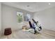 Bright exercise room with workout bench, free weights and backyard views at 6830 Compass St, North Las Vegas, NV 89084
