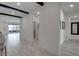 Bright, open hallway connecting various rooms, with views of the living area and backyard at 6830 Compass St, North Las Vegas, NV 89084