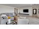 Bright living room with stylish furnishings, mounted TV, and open layout at 6830 Compass St, North Las Vegas, NV 89084