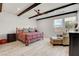 Comfortable main bedroom featuring beamed ceilings and a ceiling fan at 6830 Compass St, North Las Vegas, NV 89084