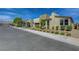 New construction home with desert landscaping along street at 6830 Compass St, North Las Vegas, NV 89084