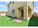 Backyard with artificial turf and covered patio area at 7189 Ashcroft St, North Las Vegas, NV 89084