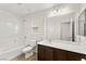 Bright bathroom featuring a tub-shower combination and wood-look flooring at 7189 Ashcroft St, North Las Vegas, NV 89084