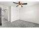 Bright bedroom featuring a ceiling fan and double sliding closet doors at 7189 Ashcroft St, North Las Vegas, NV 89084