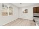 Bright dining area with natural light, showing kitchen features and wood-look flooring at 7189 Ashcroft St, North Las Vegas, NV 89084