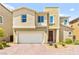 Charming two-story home with a well-maintained front yard and attached garage at 7189 Ashcroft St, North Las Vegas, NV 89084