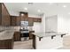 Well-equipped kitchen featuring granite countertops, stainless appliances, and island with sink at 7189 Ashcroft St, North Las Vegas, NV 89084