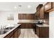 Granite countertops and stainless appliances highlight this well-equipped modern kitchen at 7189 Ashcroft St, North Las Vegas, NV 89084
