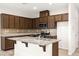 Modern kitchen with granite countertops, stainless steel appliances, and ample cabinet space at 7189 Ashcroft St, North Las Vegas, NV 89084