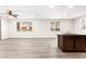 Open living space with windows, recessed lighting and an adjacent kitchen at 7189 Ashcroft St, North Las Vegas, NV 89084