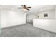 Open-concept loft featuring recessed lighting, neutral colors, and a ceiling fan at 7189 Ashcroft St, North Las Vegas, NV 89084