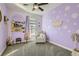 Themed ' bedroom featuring playful decor, carpet flooring, and ample natural light at 7337 Savannah Falls St, Las Vegas, NV 89131