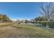 A view of the picnic area and community green space surrounded by mature landscaping at 7337 Savannah Falls St, Las Vegas, NV 89131