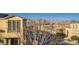 An exterior view of the community featuring modern architecture and mountain views in the background at 7337 Savannah Falls St, Las Vegas, NV 89131
