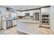 Modern kitchen with granite countertops, stainless steel appliances, and ample cabinet space at 7337 Savannah Falls St, Las Vegas, NV 89131