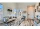 Bright living room featuring hardwood floors, neutral tones, and stylish decor at 7337 Savannah Falls St, Las Vegas, NV 89131