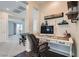 A view of a home office nook featuring a decorative desk and a view looking out to the hallway and bedroom at 7337 Savannah Falls St, Las Vegas, NV 89131