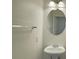 A clean bathroom featuring a sink, mirror, and chrome towel bar at 7412 Bewitching Ct, Las Vegas, NV 89149