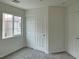 Bedroom features window, carpet, and closet with sliding doors at 7412 Bewitching Ct, Las Vegas, NV 89149