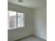 Carpeted bedroom features a bright window at 7412 Bewitching Ct, Las Vegas, NV 89149