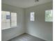 Sunlit bedroom with multiple windows and plush gray carpet at 7412 Bewitching Ct, Las Vegas, NV 89149