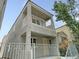 Two-story home features a cozy balcony and well-maintained landscaping at 7412 Bewitching Ct, Las Vegas, NV 89149