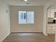 Inviting living room boasts new laminate flooring, fresh paint and kitchen access at 7412 Bewitching Ct, Las Vegas, NV 89149