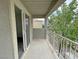 Spacious patio with metal railing and sliding glass doors at 7412 Bewitching Ct, Las Vegas, NV 89149