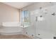 Bathroom with a walk-in glass shower and soaking tub at 7736 Villa Andrade Ave, Las Vegas, NV 89131