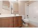 Bathroom features shower-tub combo, custom wood cabinets and granite countertop at 7736 Villa Andrade Ave, Las Vegas, NV 89131