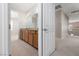 Bathroom features double sinks with granite countertops and custom wood cabinets at 7736 Villa Andrade Ave, Las Vegas, NV 89131