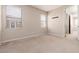 Bedroom with neutral paint, carpet flooring, and two windows at 7736 Villa Andrade Ave, Las Vegas, NV 89131