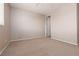 Bedroom featuring neutral paint, ceiling fan, carpet flooring, and a door at 7736 Villa Andrade Ave, Las Vegas, NV 89131