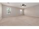 Bonus Room featuring ceiling fan, carpet flooring, two windows and neutral paint at 7736 Villa Andrade Ave, Las Vegas, NV 89131