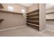 Walk-in closet with built in shelving and ample storage space at 7736 Villa Andrade Ave, Las Vegas, NV 89131