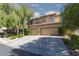 Charming two-story home with landscaped yard, mature tree and a spacious two-car garage and large driveway at 7736 Villa Andrade Ave, Las Vegas, NV 89131