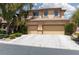 Two-story home featuring a three-car garage and well-maintained landscaping at 7736 Villa Andrade Ave, Las Vegas, NV 89131