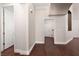 Neutral hallway features wood floors and white doors, giving access to other rooms at 7736 Villa Andrade Ave, Las Vegas, NV 89131