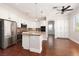 Spacious kitchen with stainless steel appliances, granite countertops, and a center island at 7736 Villa Andrade Ave, Las Vegas, NV 89131