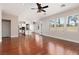 Open living room and kitchen area with windows offering backyard views and ample sunlight at 7736 Villa Andrade Ave, Las Vegas, NV 89131