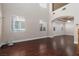 Bright living room with tall ceilings, hardwood floors, and large windows at 7736 Villa Andrade Ave, Las Vegas, NV 89131