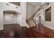Spacious living area with hardwood floors and soaring ceilings with staircase access at 7736 Villa Andrade Ave, Las Vegas, NV 89131