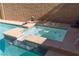 A close up of sparkling pool with a tanning ledge and a spa at 7736 Villa Andrade Ave, Las Vegas, NV 89131