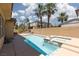 Backyard pool and jacuzzi with privacy wall and palm trees at 7736 Villa Andrade Ave, Las Vegas, NV 89131