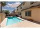 Sparkling pool with a tanning ledge, spa, and view of the two story home at 7736 Villa Andrade Ave, Las Vegas, NV 89131