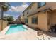 Sparkling pool with a tanning ledge, spa, and view of the two story home at 7736 Villa Andrade Ave, Las Vegas, NV 89131