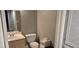 Bathroom featuring a vanity, toilet, and storage, designed for comfort and functionality at 8070 W Russell Rd # 1105, Las Vegas, NV 89113
