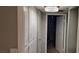 Hallway boasts ample storage with floor-to-ceiling cabinets and stylish lighting, leading to additional rooms at 8070 W Russell Rd # 1105, Las Vegas, NV 89113